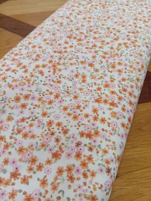 Algodón flores naranjas y rosas